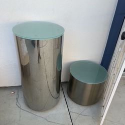 polished aluminum or chrome drum side table Owith a glass top,
