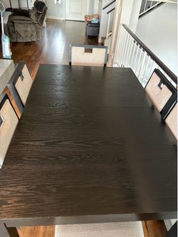 Gorgeous black dining room table with six chairs