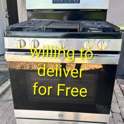 Clean GE stainless steel gas stove available. Features 5 burners plus a center griddle area