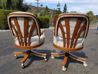 Pair of Mid-Century Rolling Swivel Chairs