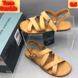 The Toms Women's Sicily Sandal in Honey; a versatile flat sandal in shimmery vegan materials with a double cross strap detail, bringing an Italian-in