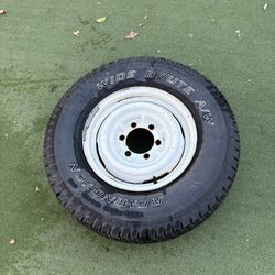 Remington Wide Brute Tire and Rim (with nail) LT235/75R15 104/101R M+S