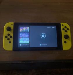 Nintendo Switch with Yellow Joy-Con Controllers