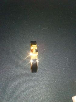 Hermes.  Gold and black bracelet