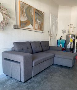 Sofá bed L-shaped convertible like new with storage and two matching stools; in excellent condition,