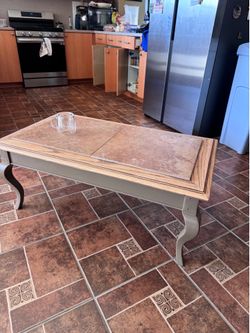 Wood coffee table with removable tiles