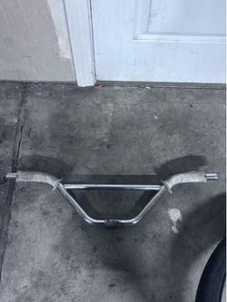 Chrome, two-piece bar with white se grips