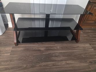 Black glass and wood TV stand