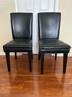 2 . Black  armless chairs