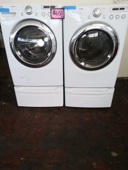 LG front load washer and dryer set with pedestals in excellent conditions