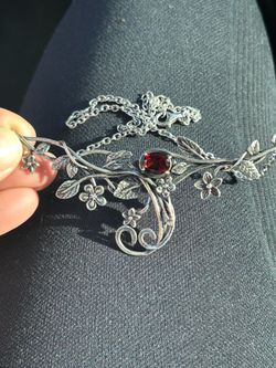 925 silver necklace and ring with garnet stones.