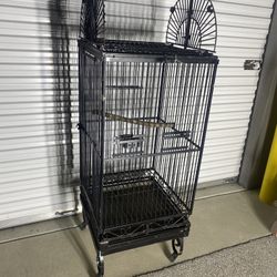 bird cage 6ft tall. Heavy duty quality made with casters. Excellent used condition Swap Shop Flea Market pick up or Delivery available. $150 firm Brow