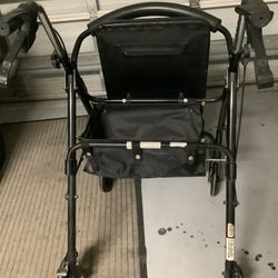 Walker 4 Wheels Good Brakes Carry Bag Under The Lift Up Seat, Firm Seat , Walker Folds Up, Good Tires
