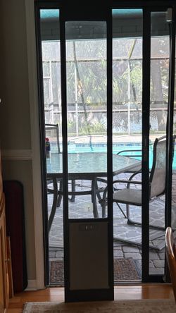 Sliding dog door for sliders