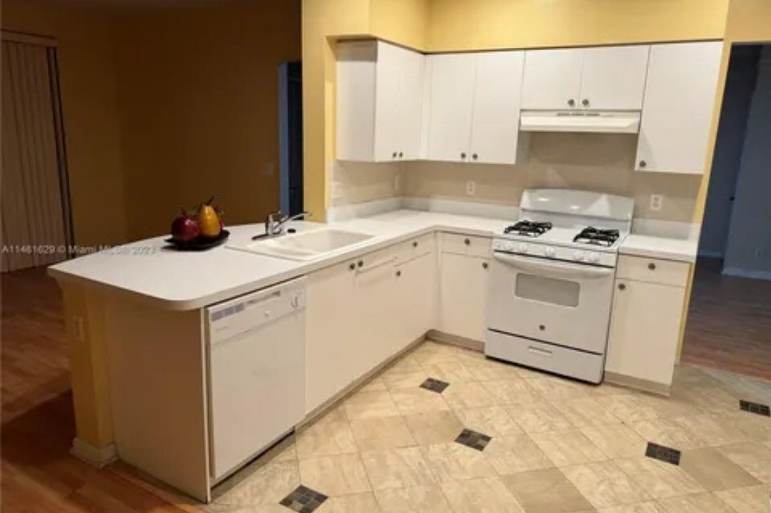 Dishwasher, Gas Stove, Sink,  and Full Size  Dryer