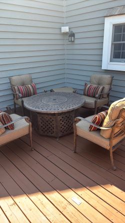 Fire Table with 4 Padded chairs & Bench No rips or rust lightly  used