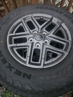 Brand new set of jeep wrangler wheels and tires