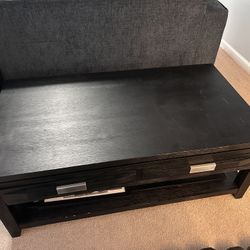 Black wooden coffee table with drawers