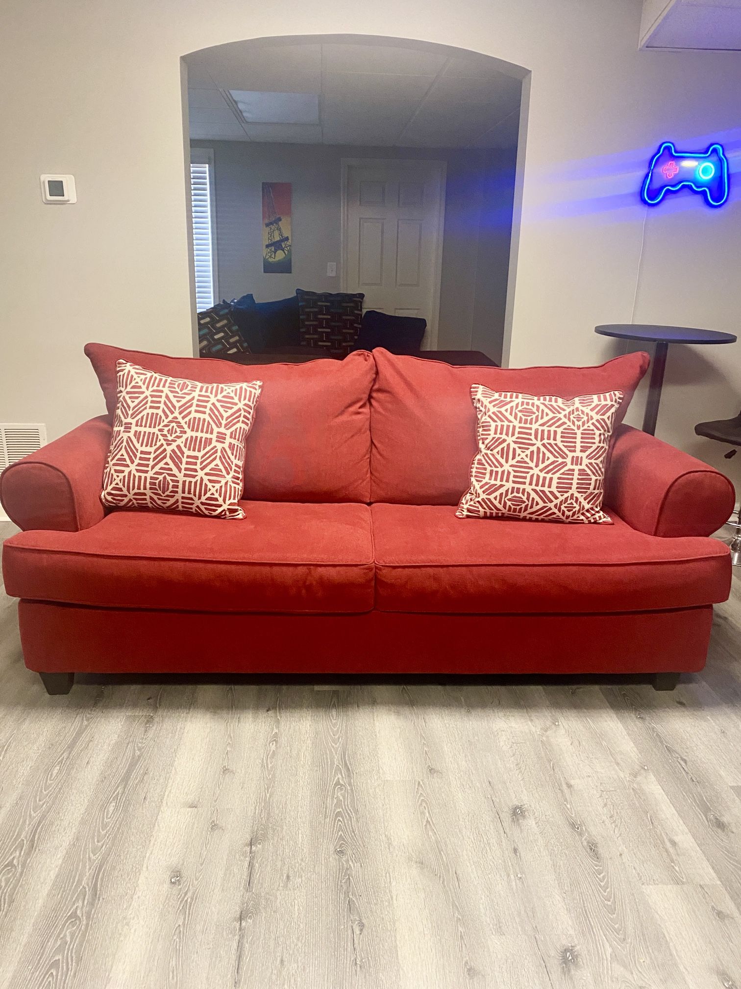 Barely Used Red Sofa with Pull-Out Queen Bed