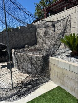 Batting cage with poles