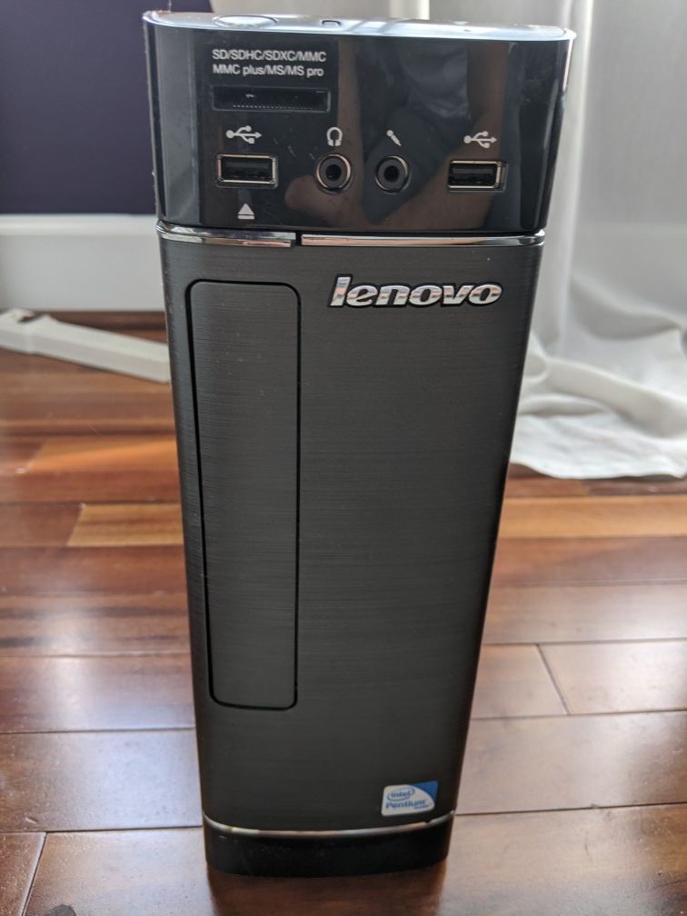 Lenovo computer with monitor, keyboard, mouse, speakers, and wireless adapter