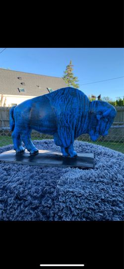 The old blue buffalo statue