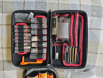Hand gun and rifle cleaning kit and lage bag of cleaning pads