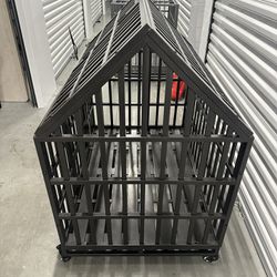 BLACK CARBON STEEL DOG/PET CAGE WITH WHEELS ONLY 2-WHEELS ARE SLIGHTLY DAMAGED BUT STILL WORK