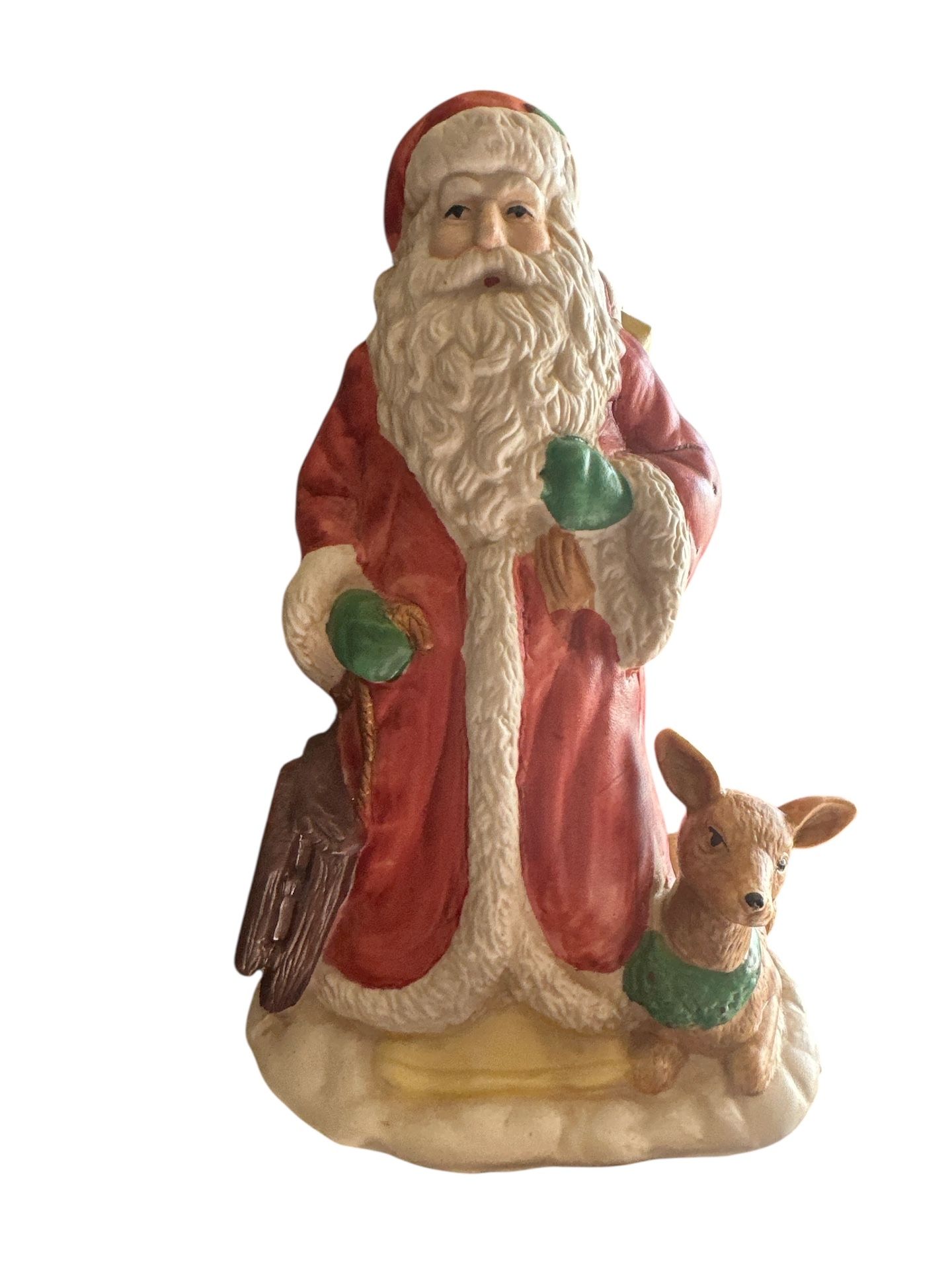 Santa This vintage musical figurine features Santa Claus riding in his sleigh pulled by a team of deer. The intricate details of the figurine make it