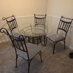 Glass dinning table + 4 metal chairs