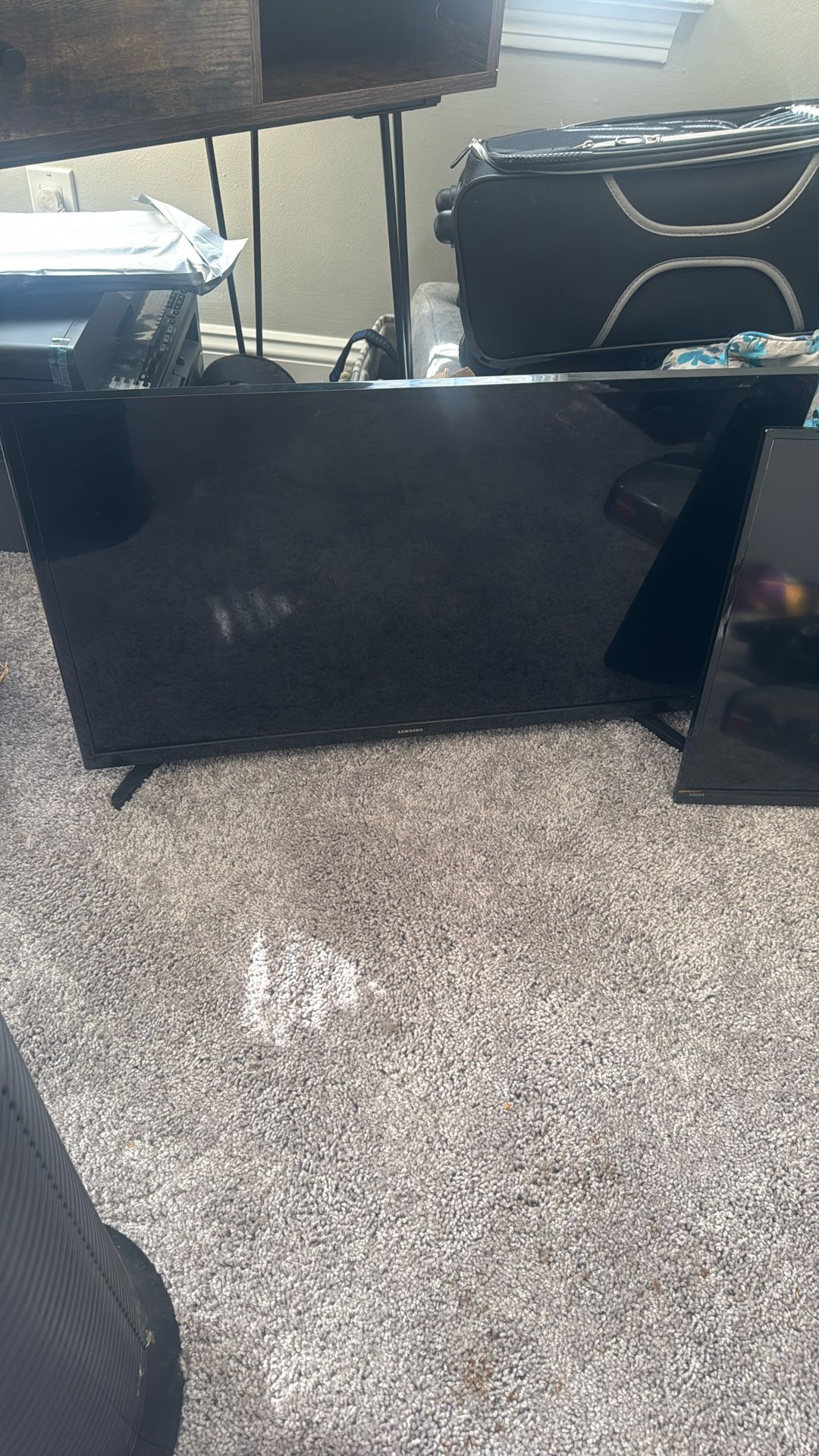 Two TVs With Remotes And Cords