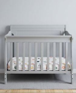Mini Crib with mattress included  (Dream on Me 3 in 1 convertible)