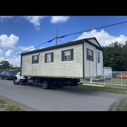 Shed Relocate. Movemos Casita De Patio Crane Container Sale 