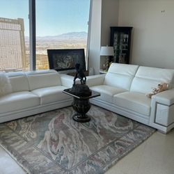 Genuine white leather sofas with chrome colored legs