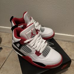 fire red jordan 4s 