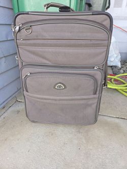 Brown softside rolling upright suitcase