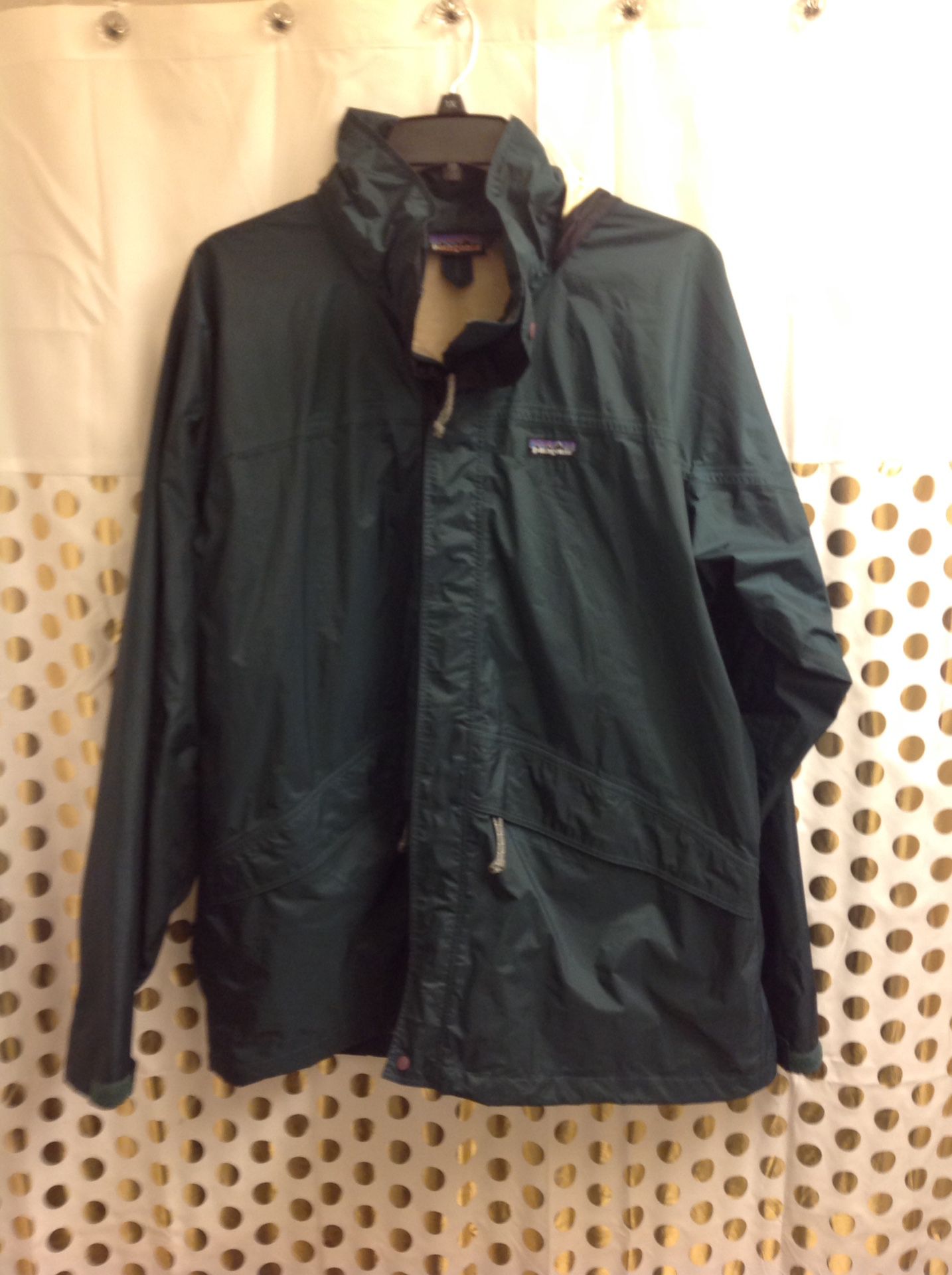 patagonia rain jacket Waterproof windbreaker Men XL dark Forrest emerald green color Only flaw is at the hood, see photos. Priced accordingly