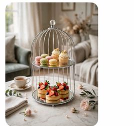 A two-tier dessert display stand featuring a birdcage design with silver metal lines and an exquisite crystal ornament at the top.
