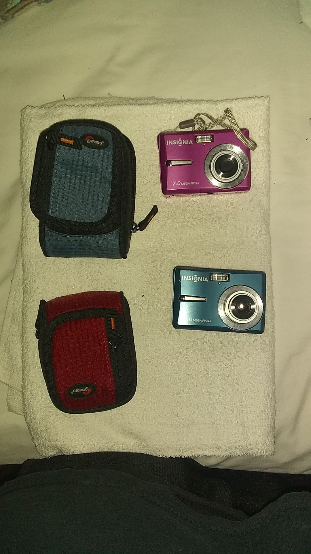 2 Insignia digital cameras with cases.