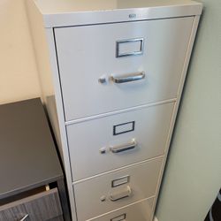 9 Tall File Cabinets   $100 Each