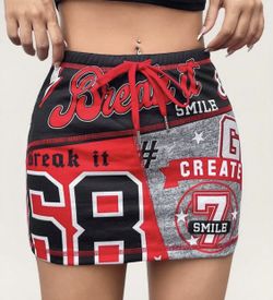 SHEIN Red and Black Graphic Mini Skirt Bold mini skirt with graphic print. Features red and black design. Perfect for a trendy look.