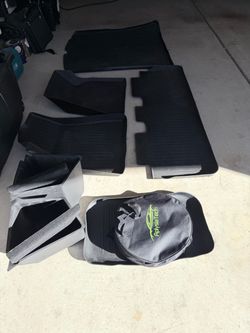 Tesla Model Y all weather mats and charger