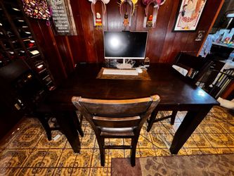 Tall dining table and three chairs