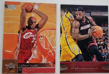 Two collectible basketball trading cards featuring NBA superstar LeBron James.