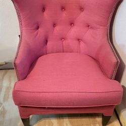 pink fabric chair in good condition with studs