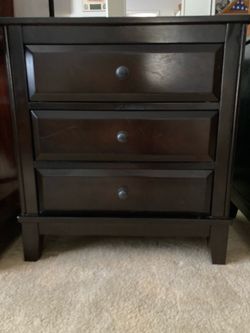 Two dark wood nightstands