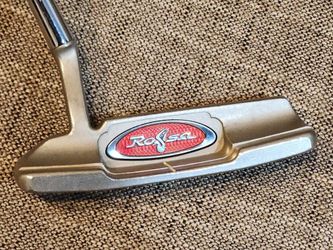 TAYLORMADE ROSSA INDY SPORT-6 BLADE PUTTER WITH TAYLORMADE PISTOL GRIP , PLAYS AT 33". INCREDIBLY STABLE AND GREAT FEEL AND ROLL OFF THE FACE.