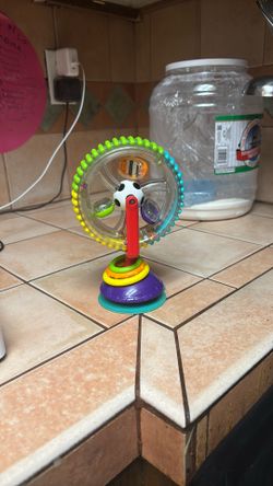 These Are Three Baby Toys, One For Reading One For Music And One For Playing