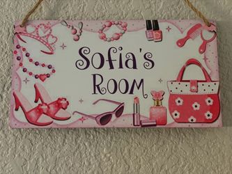 Adorable decorative wall sign featuring a sweet pink design