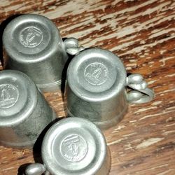 vintage pewter shot glasses, likely made in Germany 